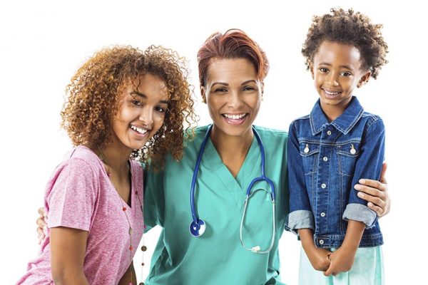 Female doctor or nurse with cute Ethiopian patients; studio shot ...